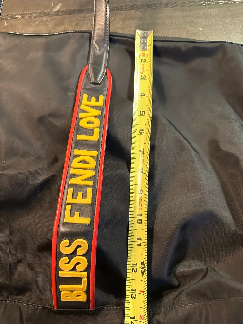 Fendi Black Duffel Bag with Yellow and Red Logo Straps